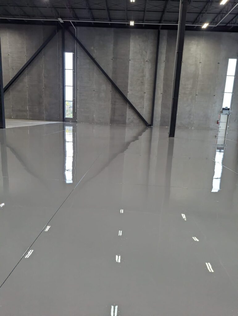 Epoxy & Polyaspartic Flooring Project Gallery in Southern Ontario 23 Concrete floor coating installation with durable finished surface