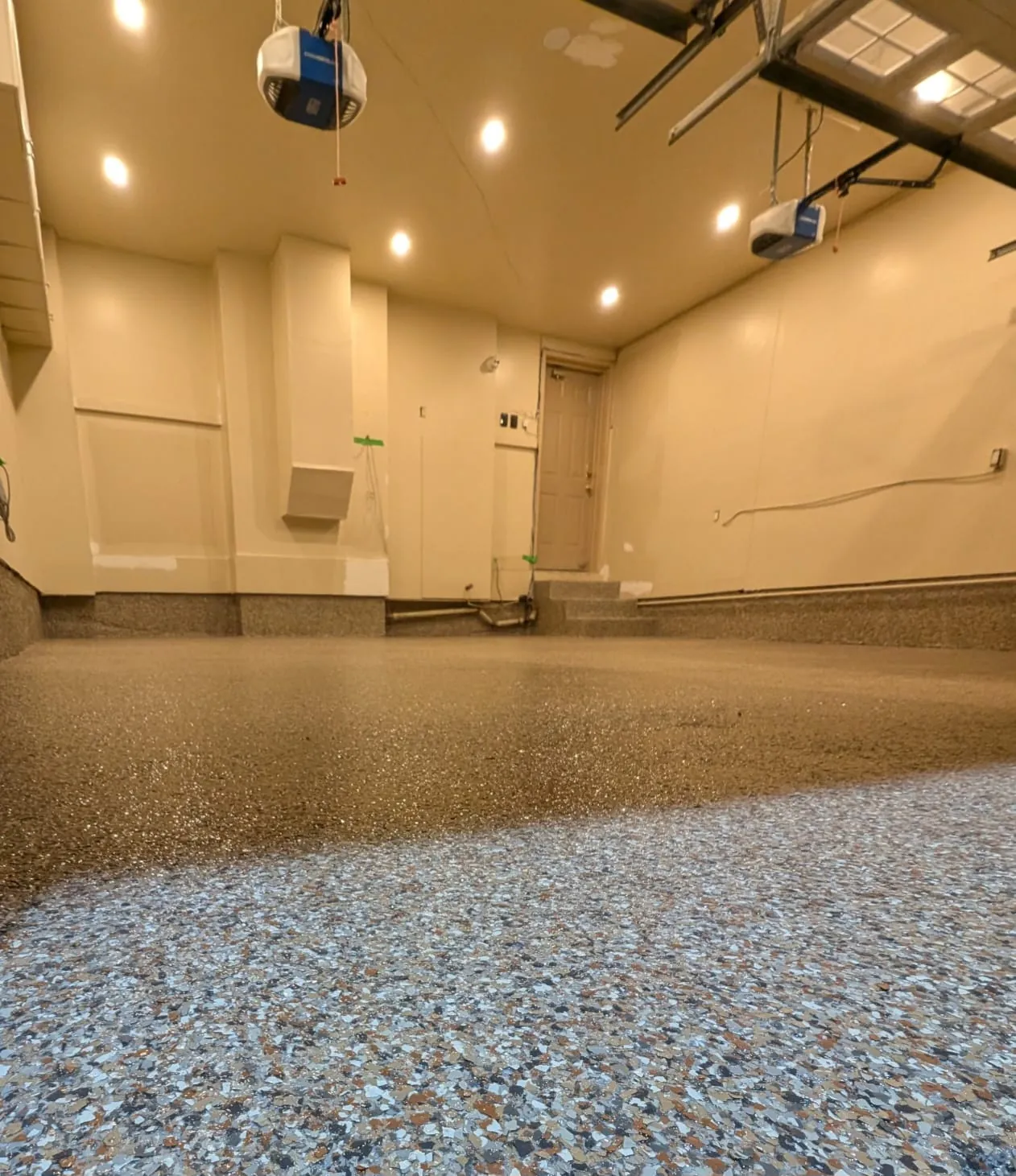 Warm grey and tan decorative flake floor in a Brampton garage