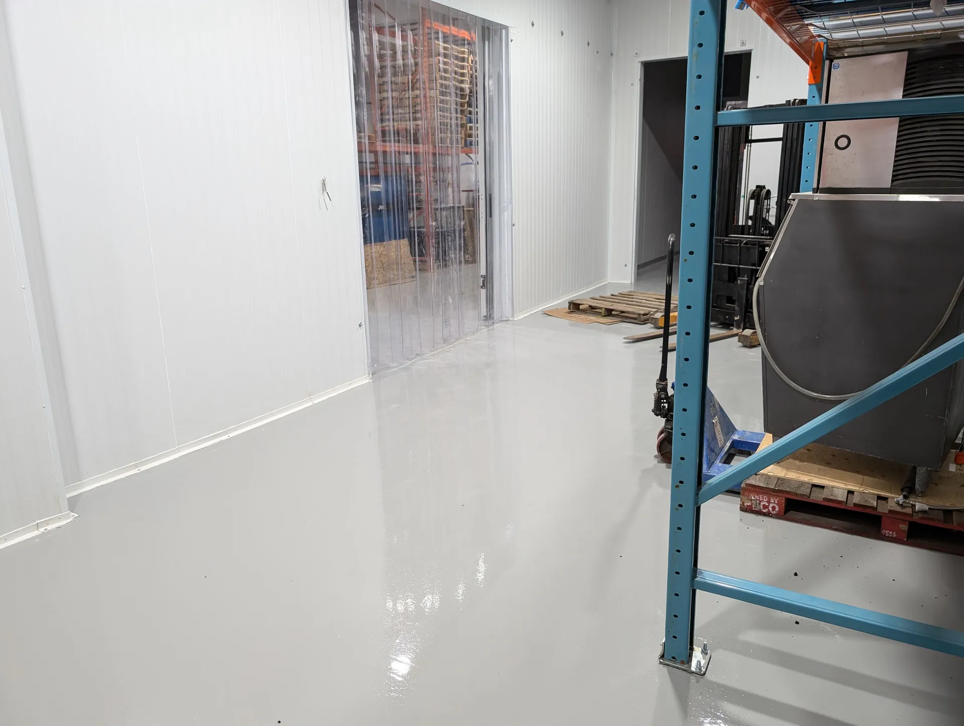 Finished light-grey coating in a warehouse service and storage area